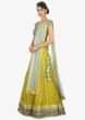 Sky blue raw silk embellished blouse paired with a canary yellow georgette lehenga and net dupatta
