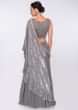 Smoke grey georgette skirt paired with embroidered net top and grey chiffon wrap around 