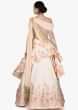 Stunning gown in cream pink with stunning embroidery in pearls and beautiful drape only on Kalki