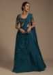 Teal Flared Lehenga Choli With Fancy Cut Out Hem And Attached Frill And Cowl Drape 