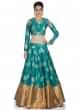 Turquoise Silk Top and Skirt with Cream Organza Dupatta Crafted with Moti and Zardosi Work only on Kalki