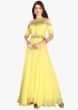 Vibrant yellow gown in georgette with cold shoulder and embroidered bodice