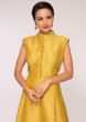 Yellow brocade anarkali dress matched with a grey georgette weaved dupatta 