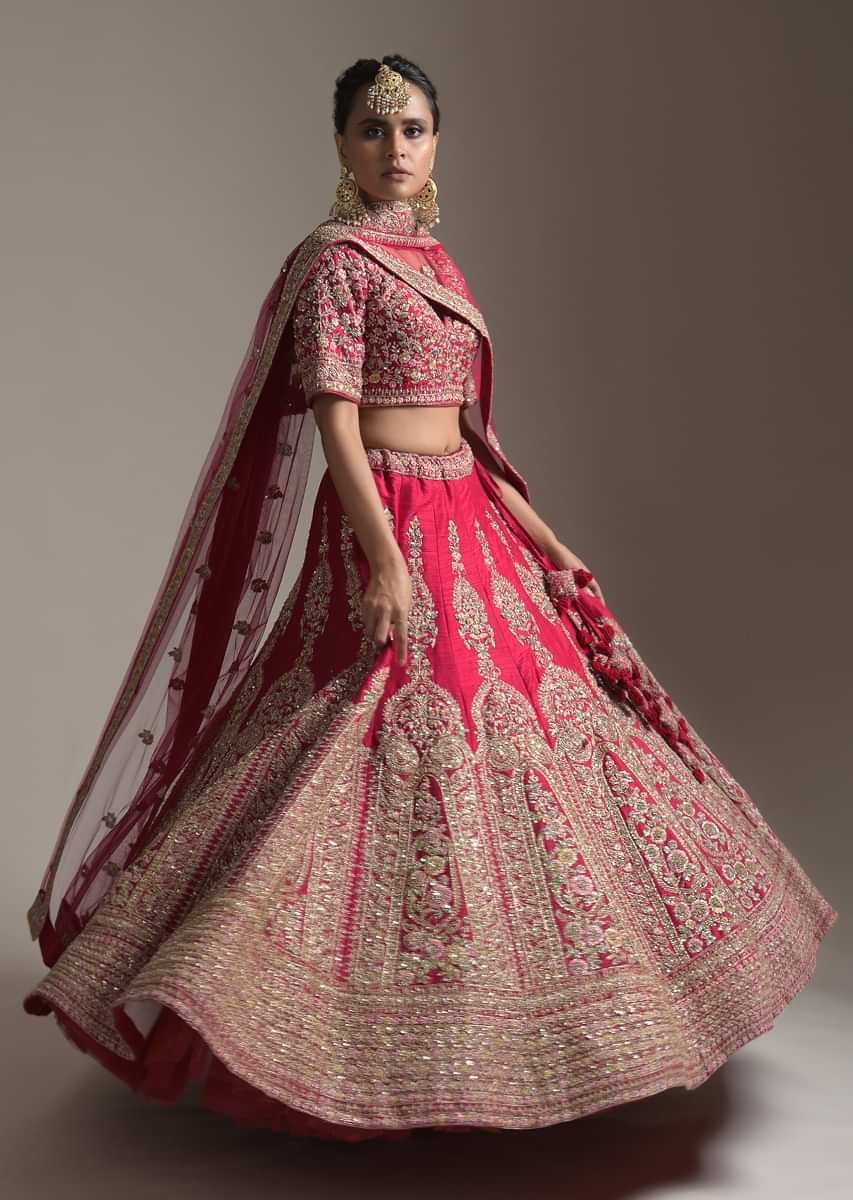 Dark Cranberry Pink Bridal Lehenga Choli In Raw Silk With Resham And Zari Embroidered Floral Kalis 