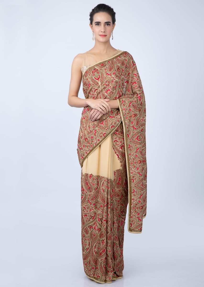 Dark cream georgette saree with multi color embroidered pallo and lower bottom only on kalki