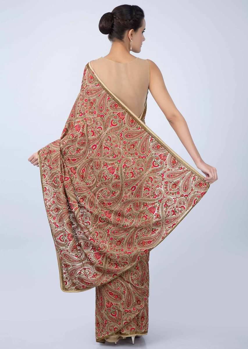 Dark cream georgette saree with multi color embroidered pallo and lower bottom only on kalki