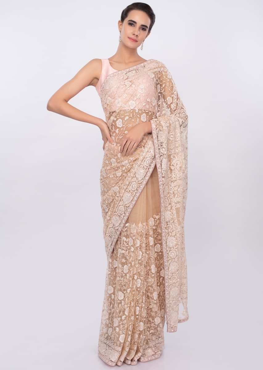 Dark cream net saree with floral jaal embroidery only on kalki