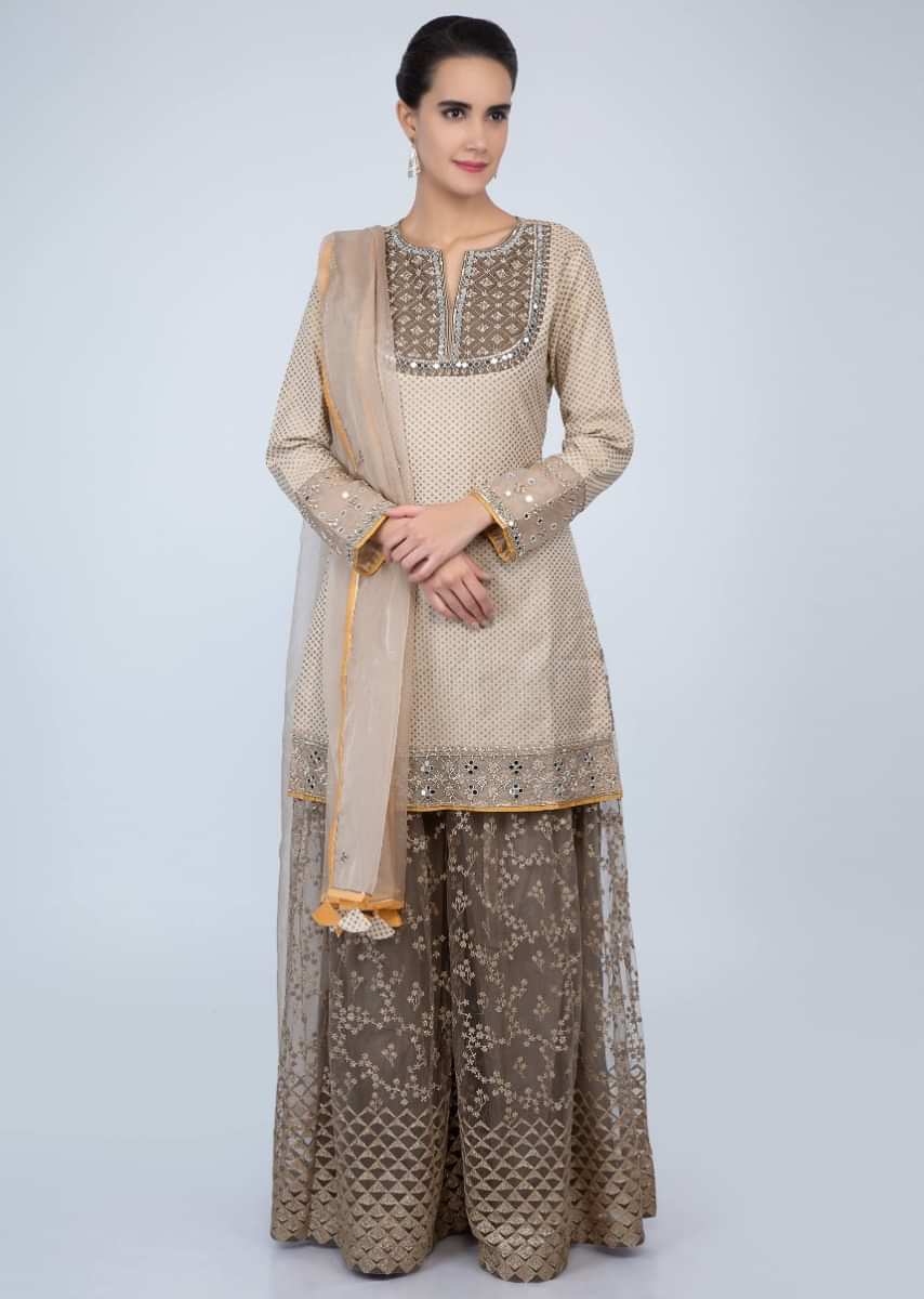 Dark cream weaved suit and organza dupatta with peanut brown embroidered net palazzo only on Kalki