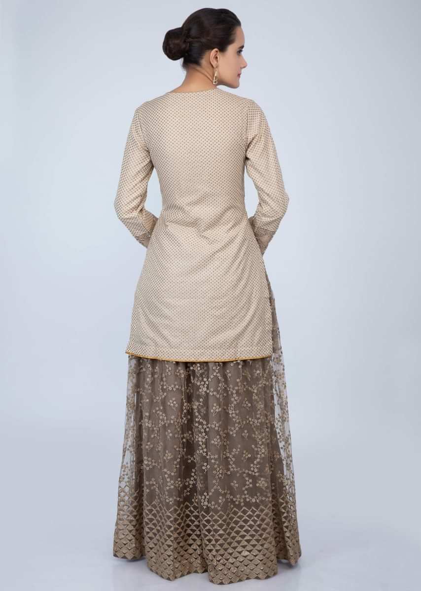 Dark cream weaved suit and organza dupatta with peanut brown embroidered net palazzo only on Kalki