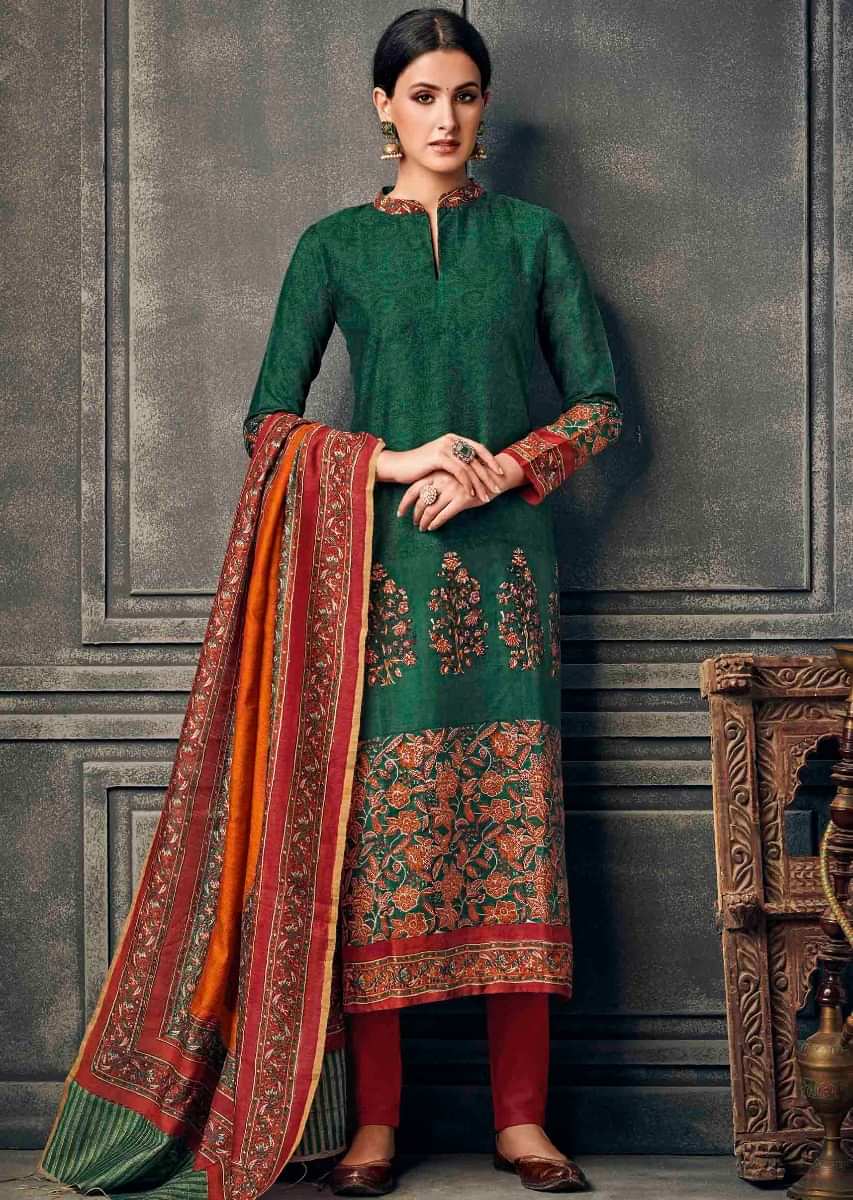 Dark green suit in silk with floral printed collar and hem line 