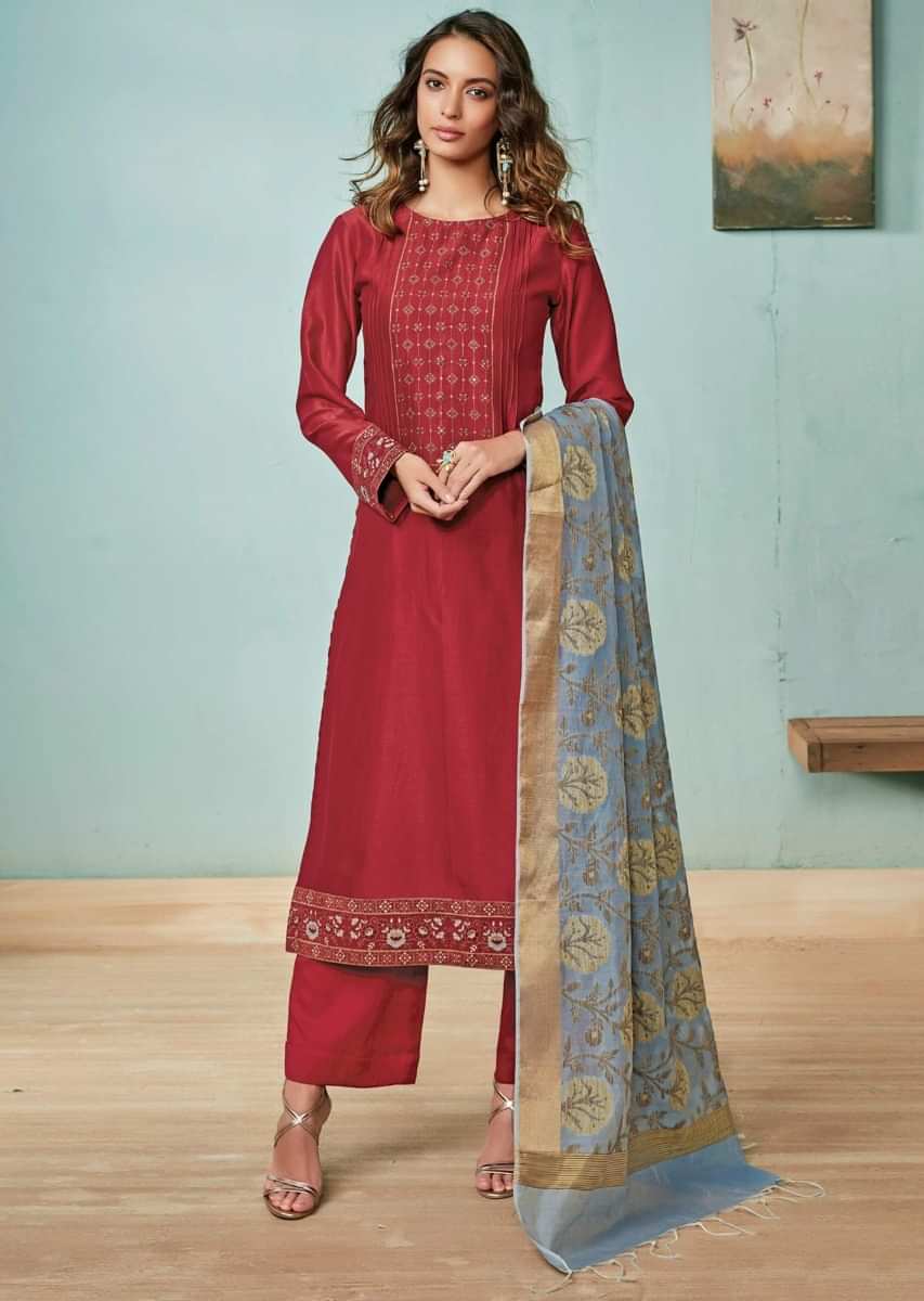 Dark maroon unstitched suit adorn in printed placket matched with  turq blue dupatta