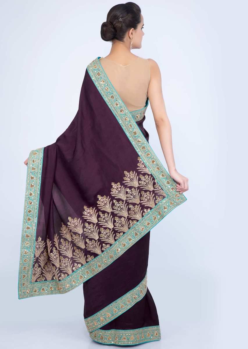 Dark plum silk saree with cord and sequins embroidered pallo and border only on Kalki