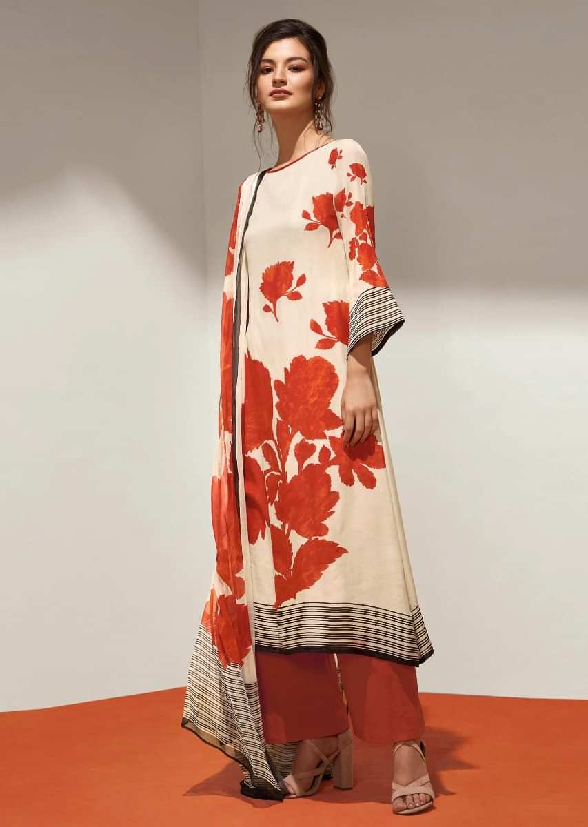 Dark orange and cream unstithced suit with floral pritned hem line and sleeveonly on Kalki