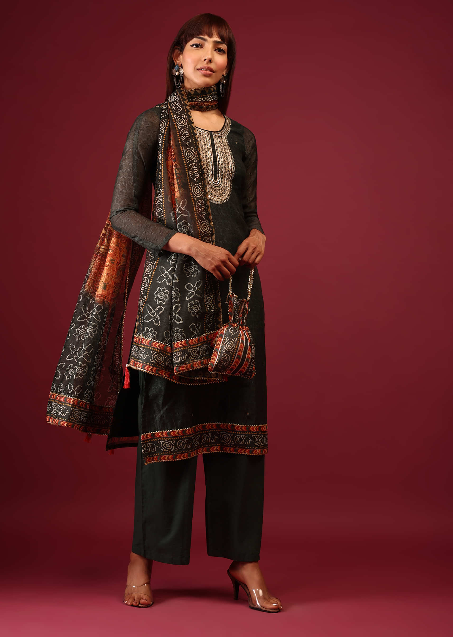 Deep Green Printed Palazzo Suit In Tussar Silk With A Stunning Potli Bag