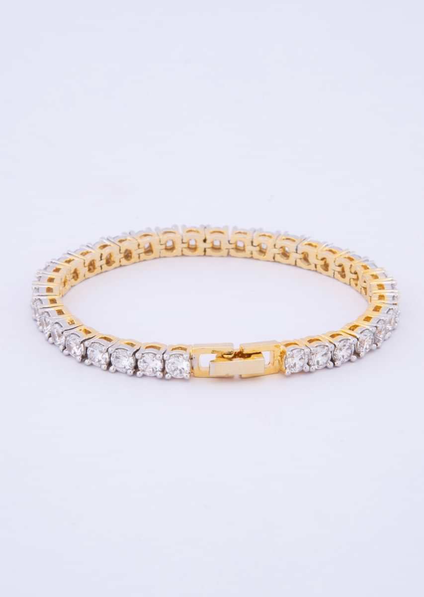 Diamond studded bracelet with shiny gold base only on kalki