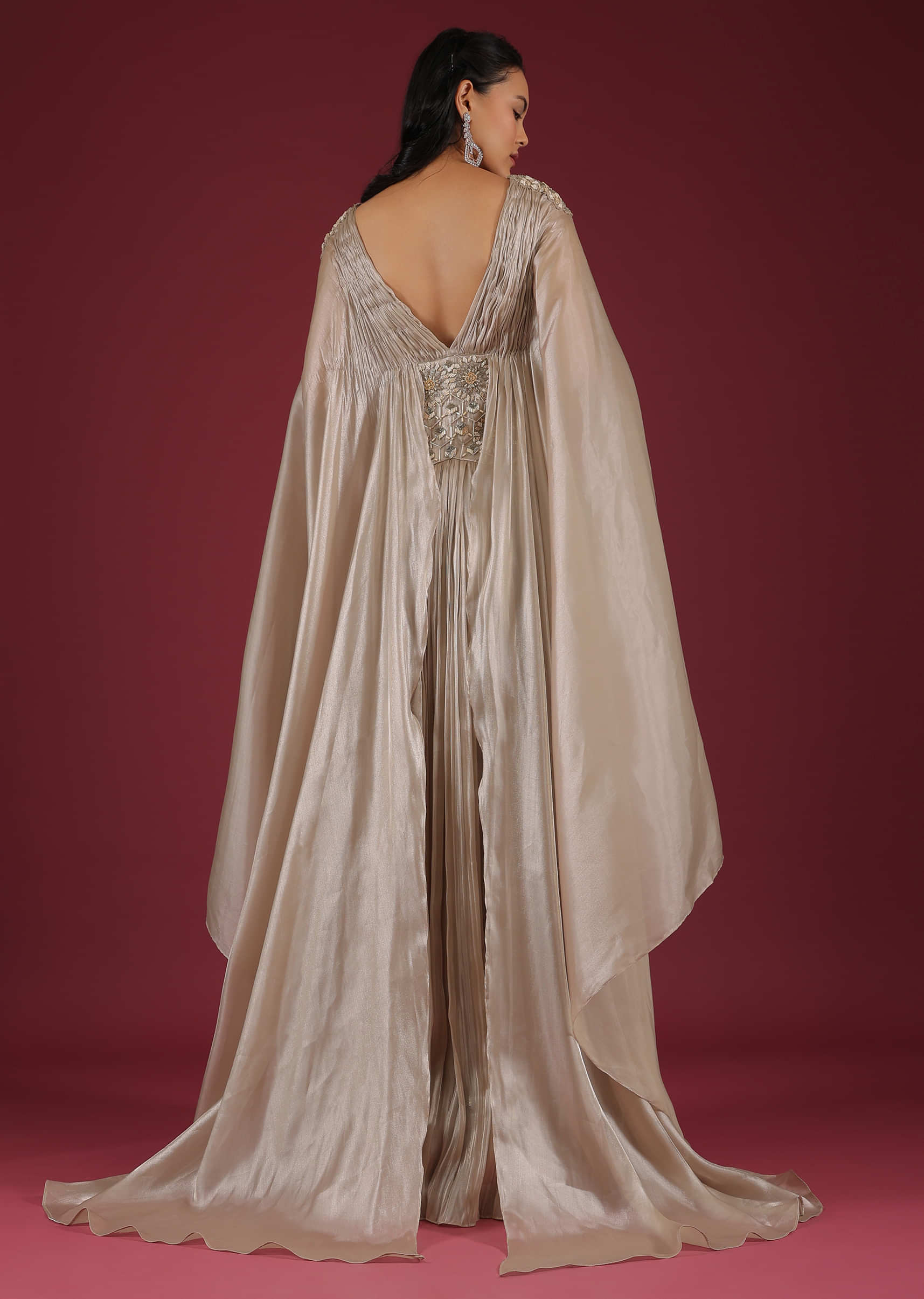 Doe Organza Gown With A Long Extended Cape Sleeves And A Plunging V Neckline