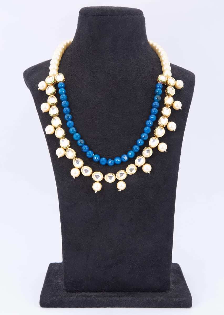 Double layer necklace adorn with cream pearls, kundan stone and round blue beads only on kalki