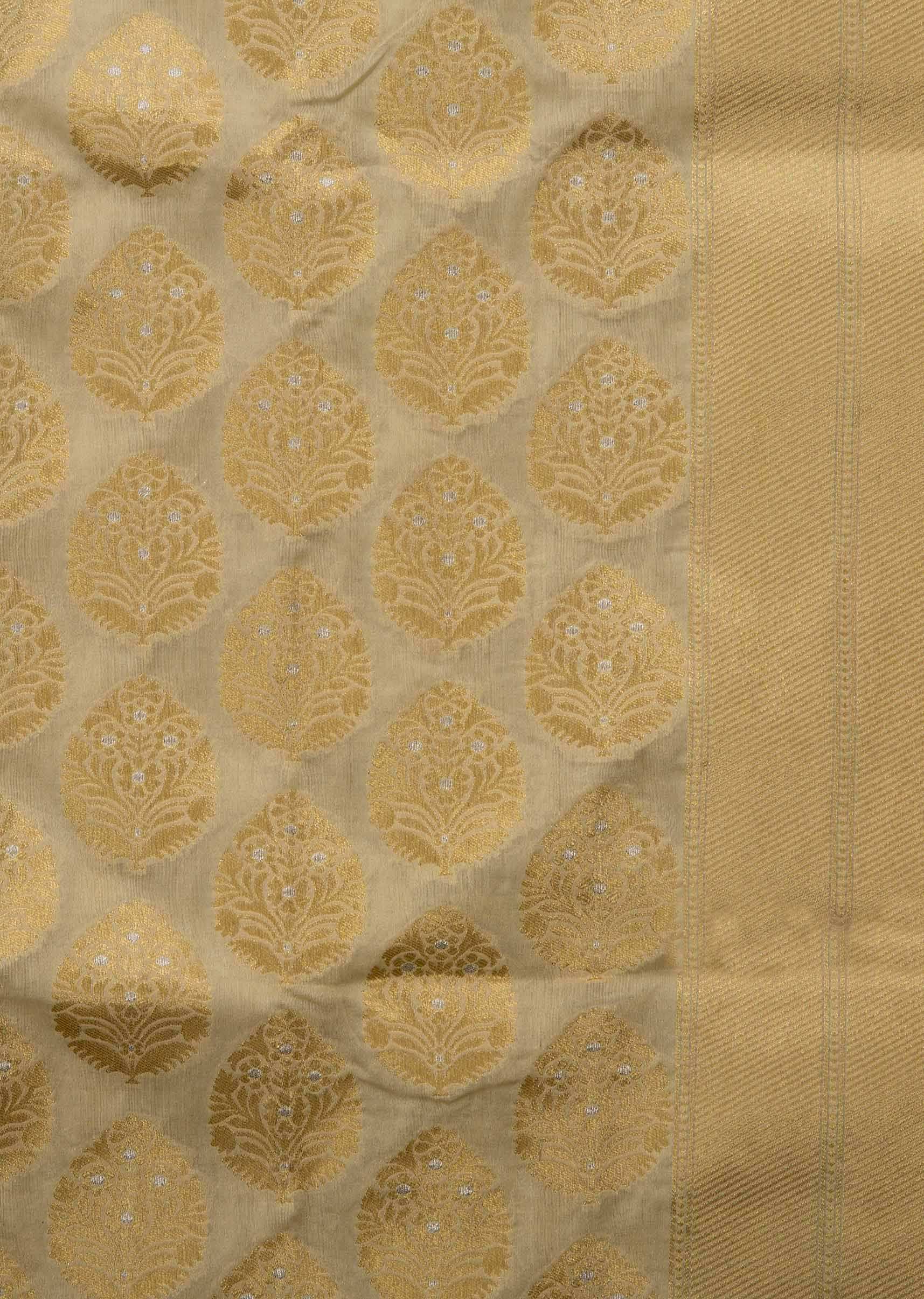 Dusky cream saree in chanderi silk with zari weaved butti all over 