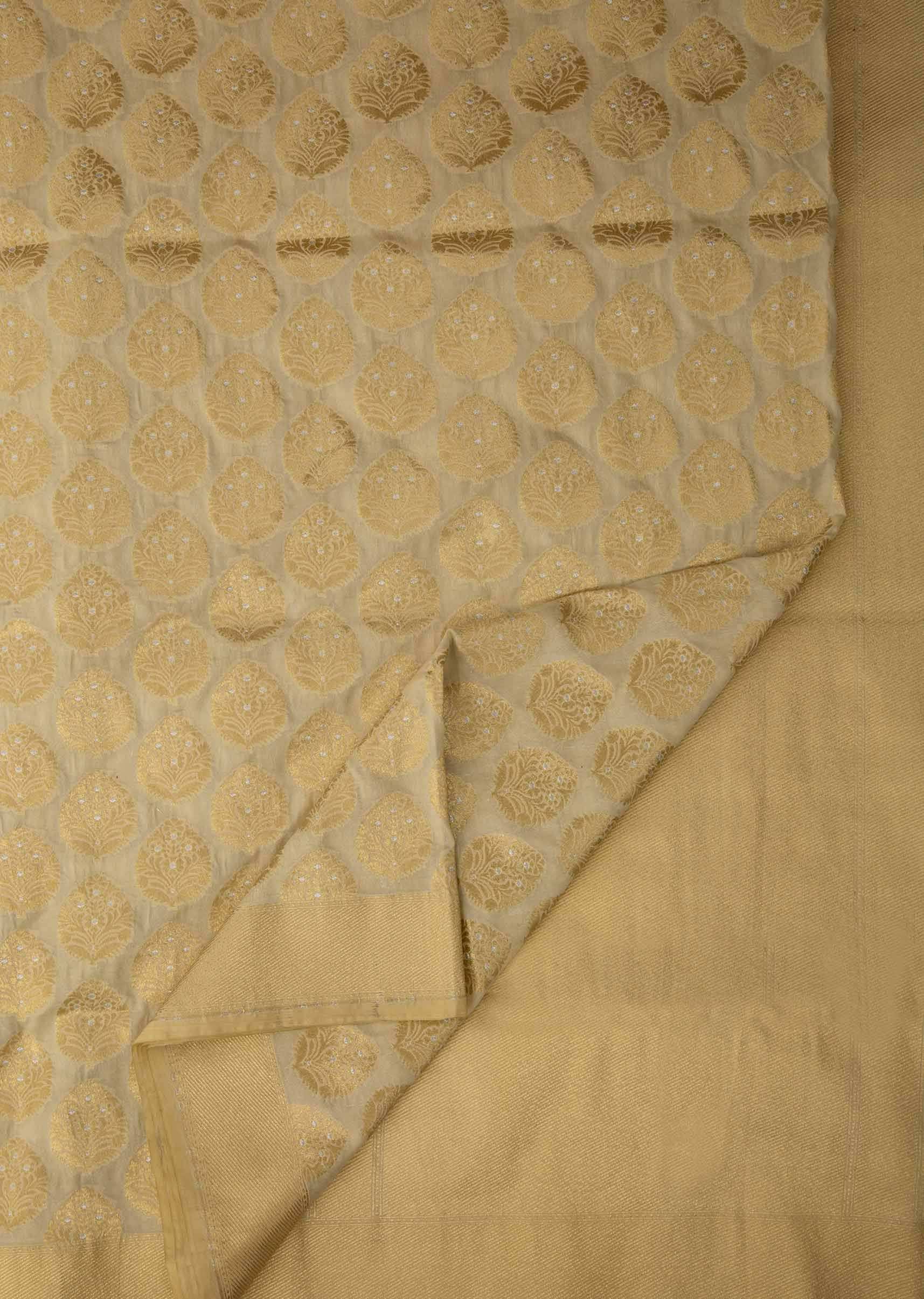 Dusky cream saree in chanderi silk with zari weaved butti all over 