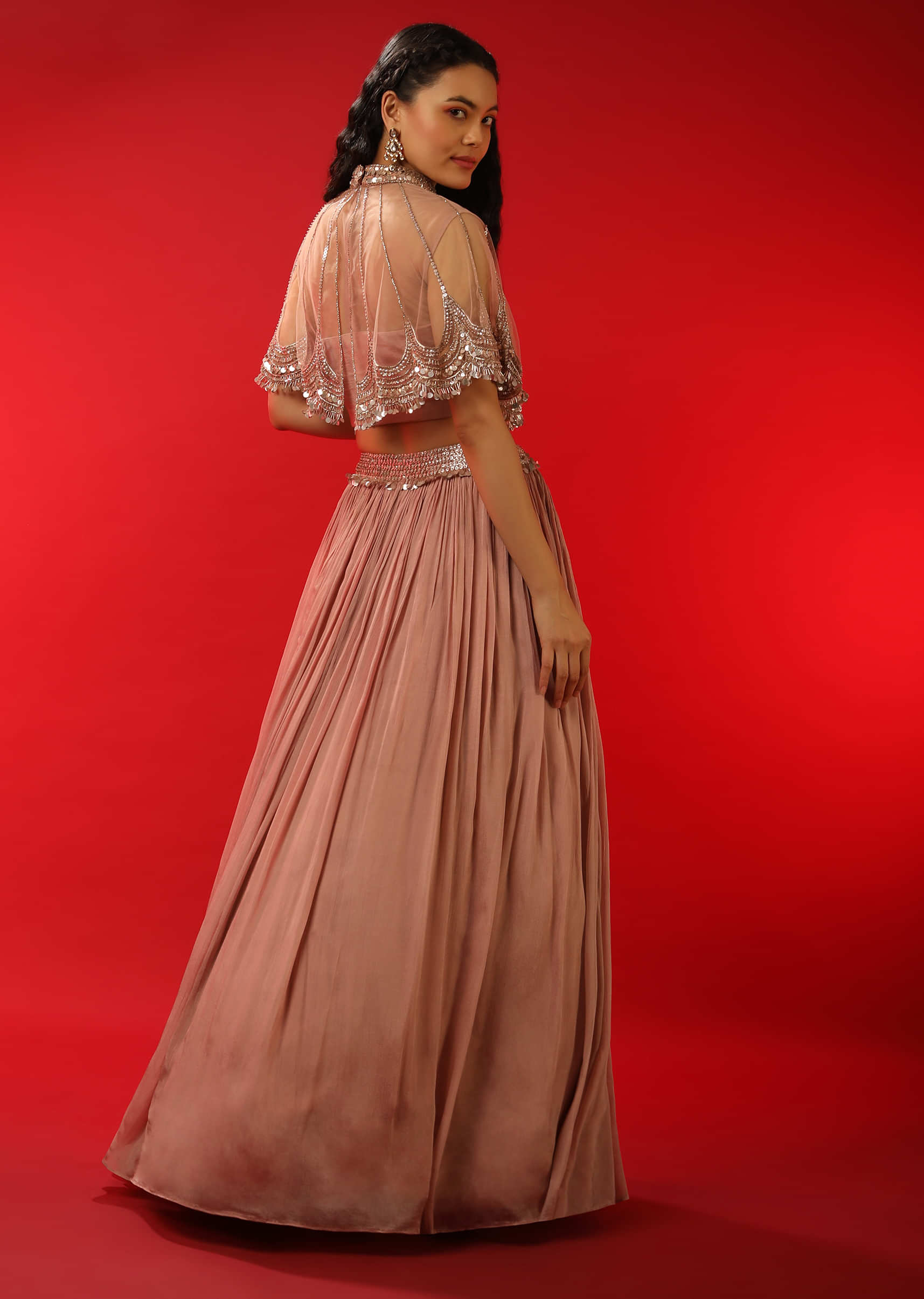 Dusty Mauve Skirt And Crop Top With Attached Net Cape And Adorned In Sequins And Zardosi Embroidery 