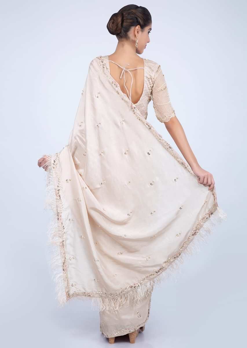 Ivory Saree With Embroidery And Feathers On The Border Online - Kalki Fashion