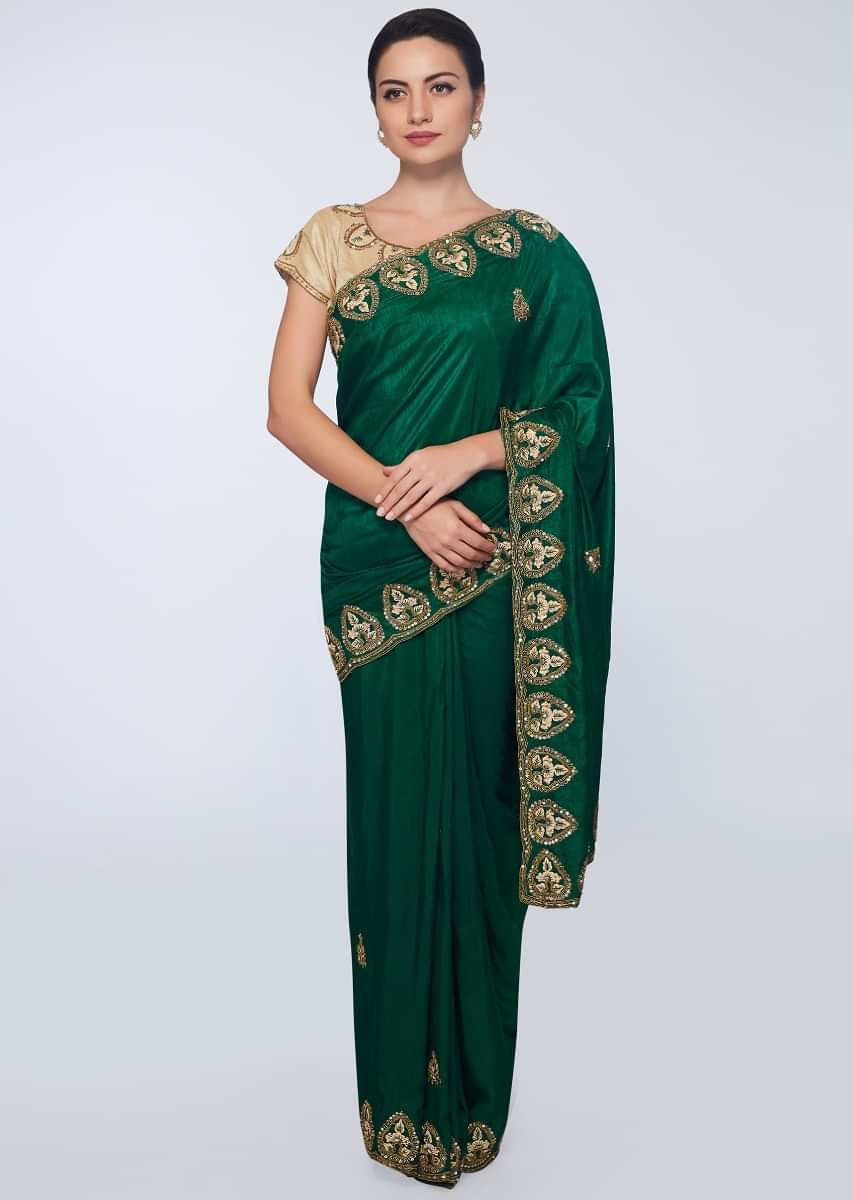 Emerald green  cotton silk saree in embroidered butti and border 
