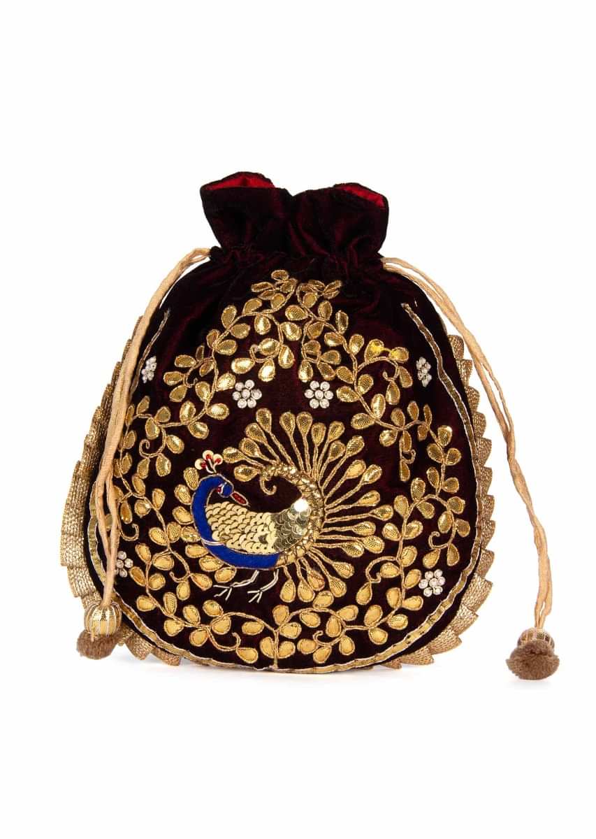 Featuring velvet potli bag in gotta patch work in peacock motif kalki