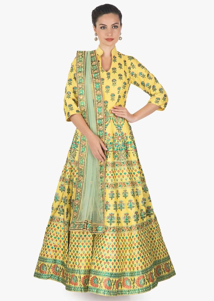Featuring yellow anarkali in print and sequin motifs only on kalki