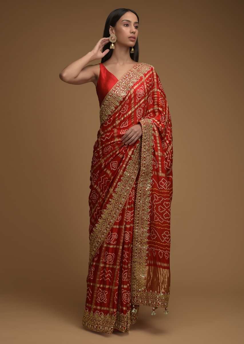 Fiery Red Saree With Bandhani Print And Gotta Patti Work Paired With Unstitched Blouse