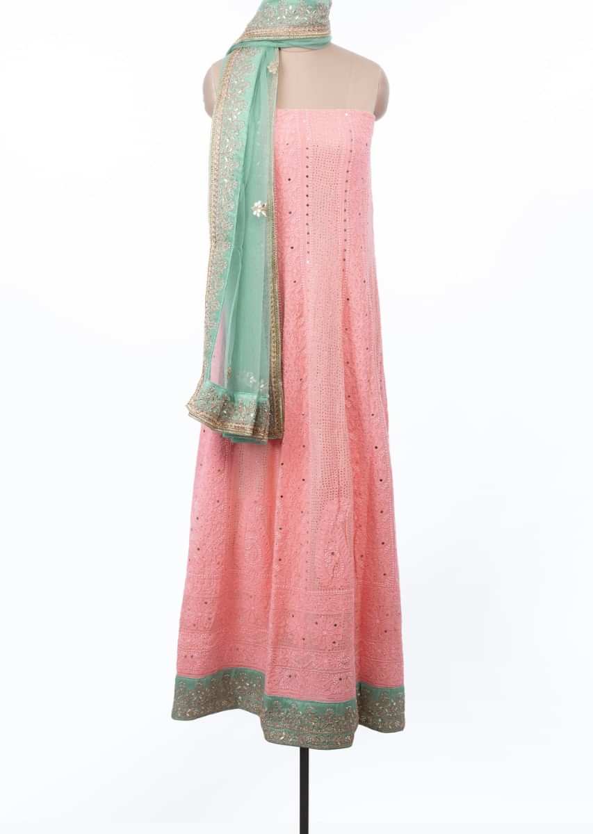 Flamingo pink semi stitched lucknowi embroidered suit set with fern green net dupatta only on Kalki