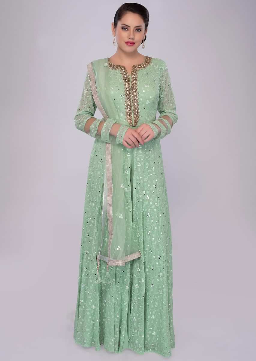 Floral green sharara suit set in self thread embroidered jaal work
