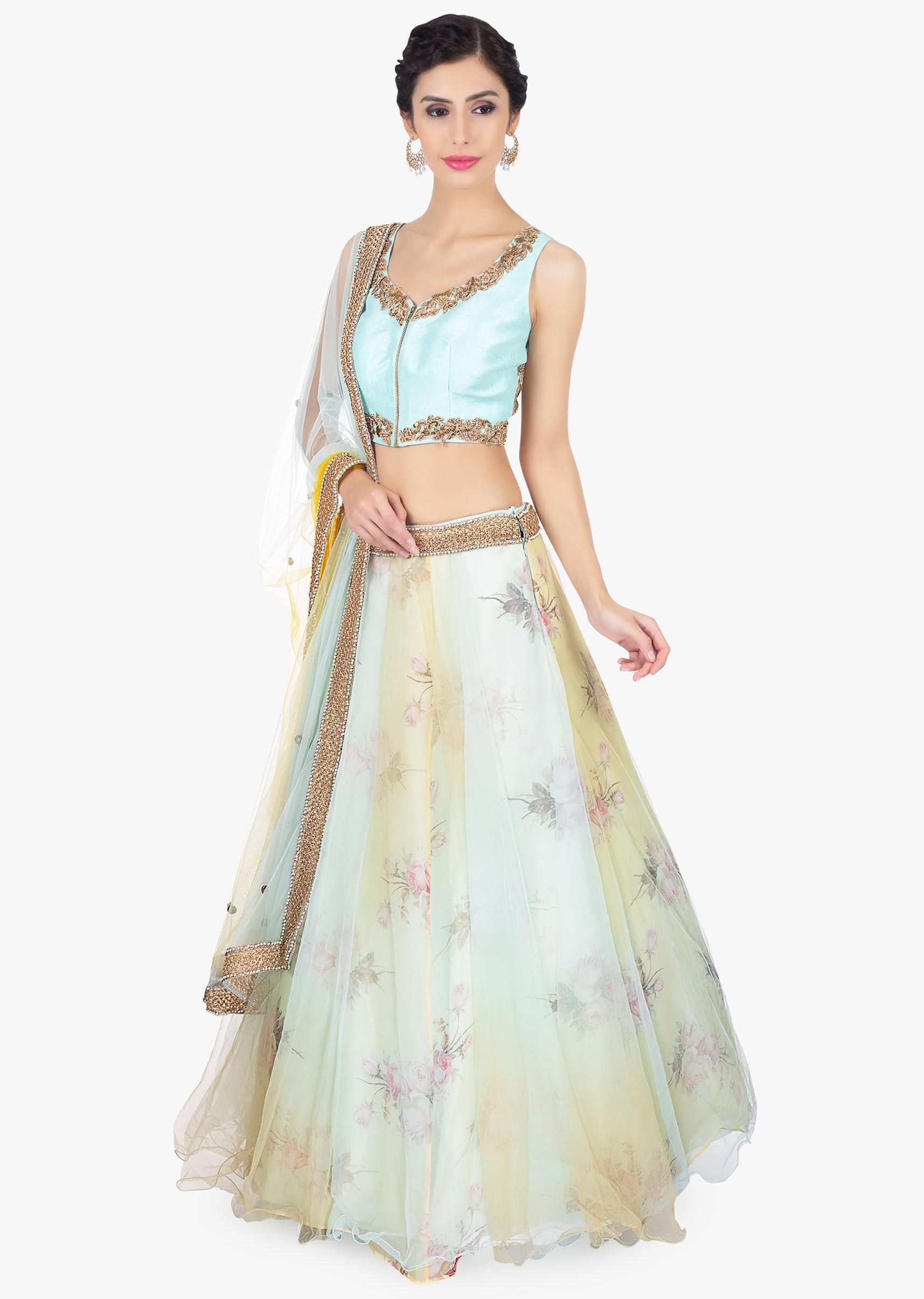 Floral printed organza lehenga with net top layer paired with a mint blouse and net dupatta 