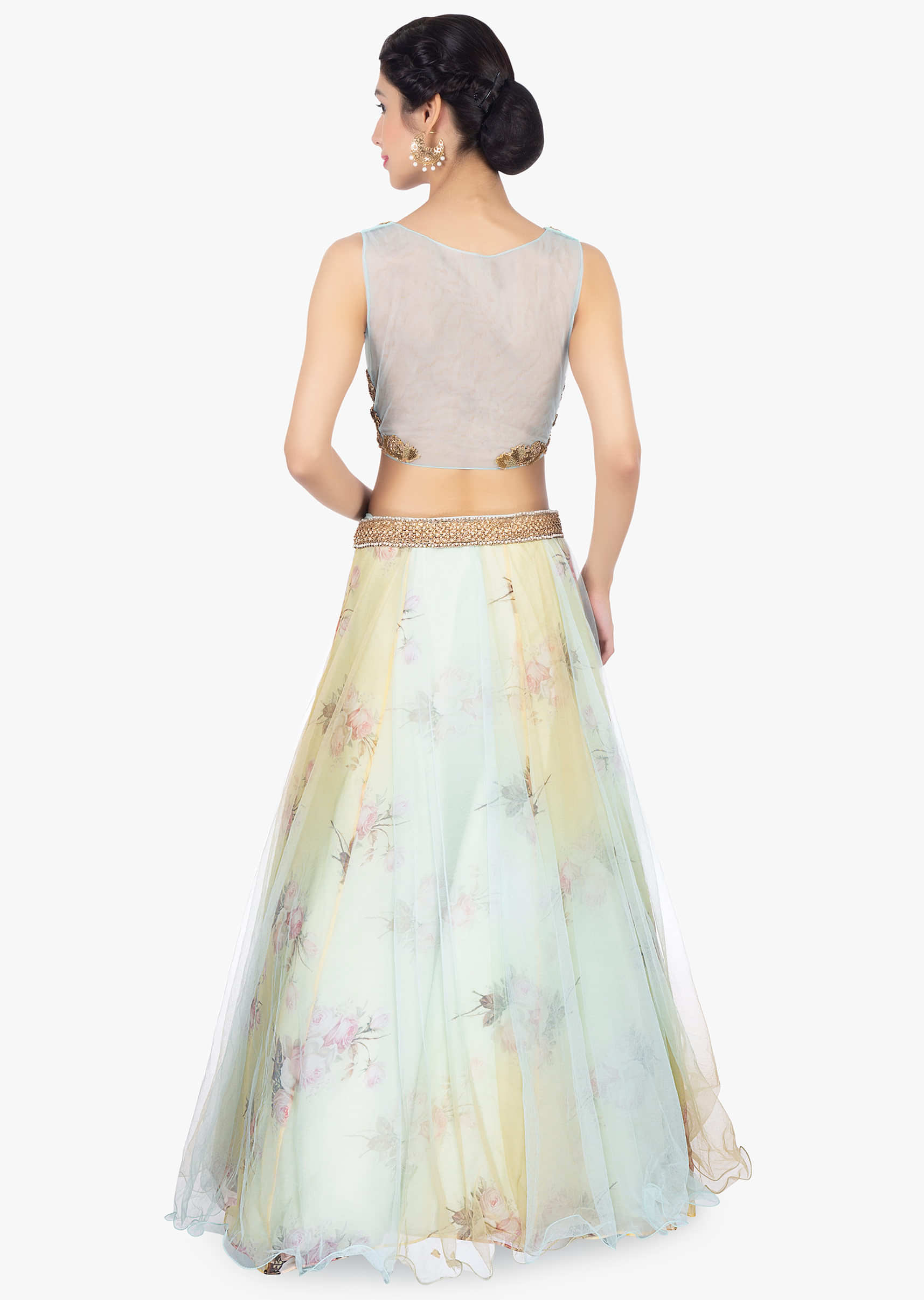 Floral printed organza lehenga with net top layer paired with a mint blouse and net dupatta 