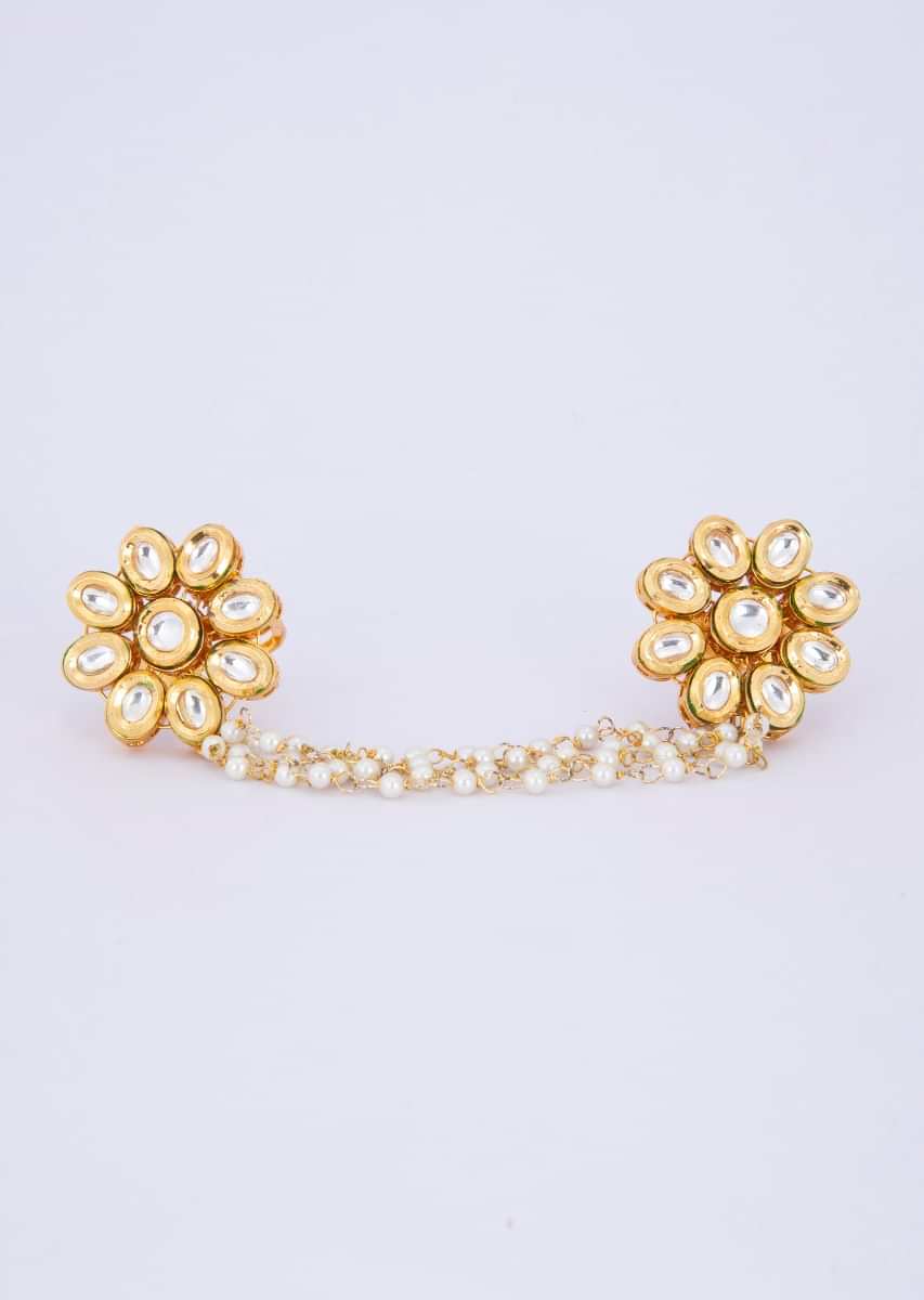 Floral shape polki kundan rings with attached multi layer moti chain only on Kalki