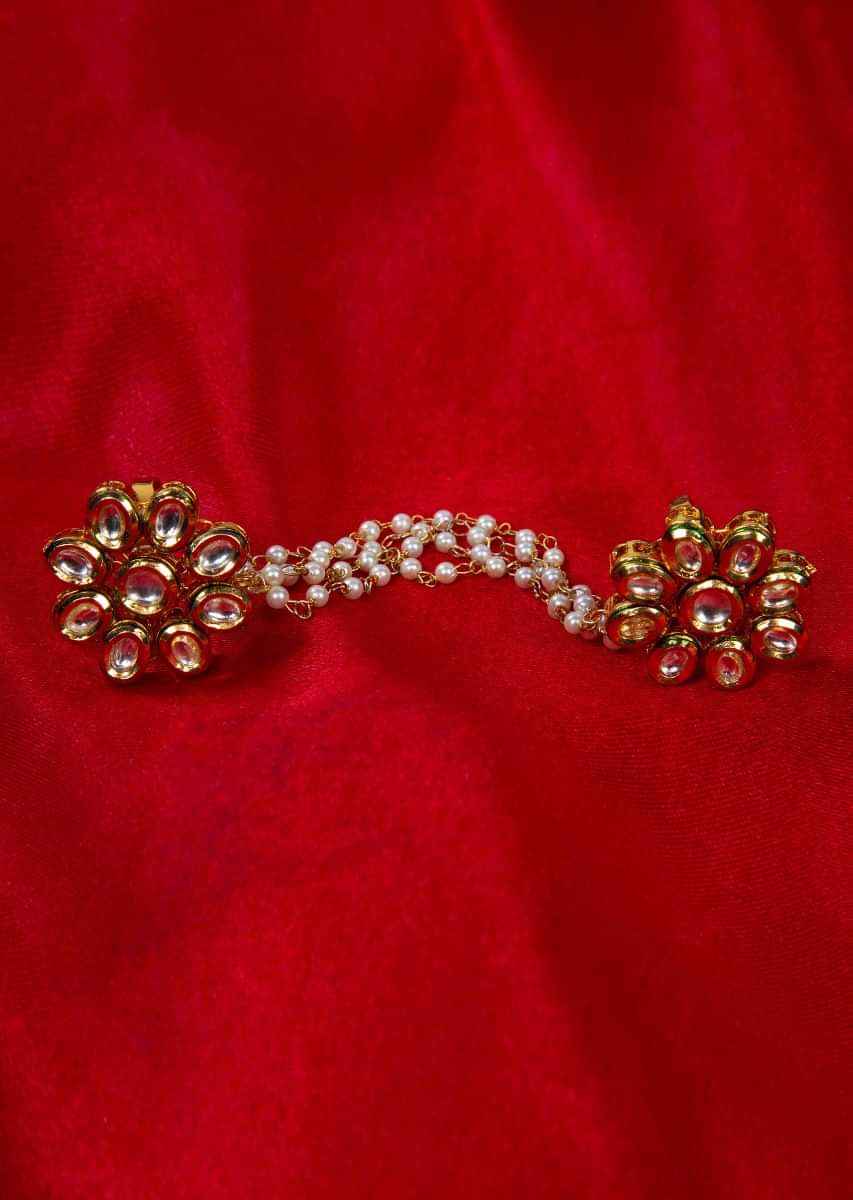 Floral shape polki kundan rings with attached multi layer moti chain only on Kalki