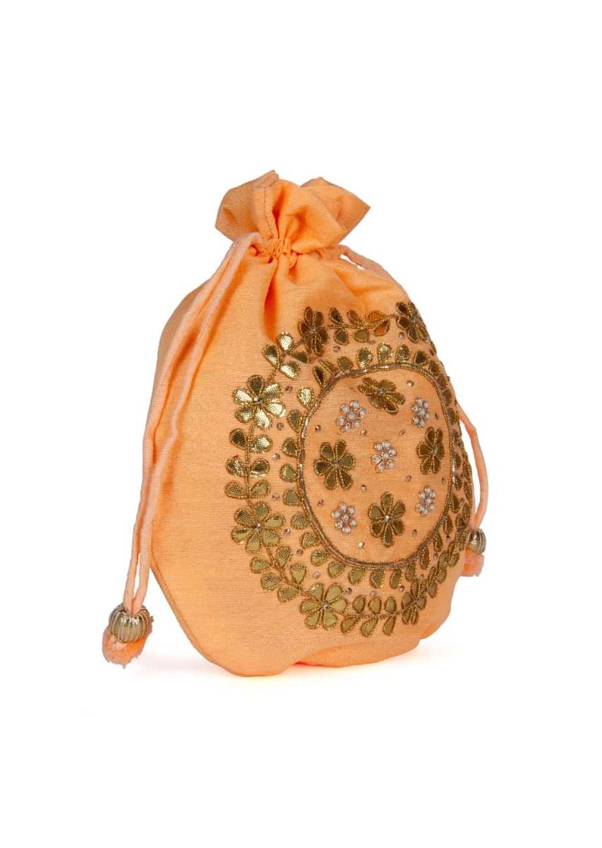 Florescent orange velvet potli bag embellished in gotta patch and moti kalki