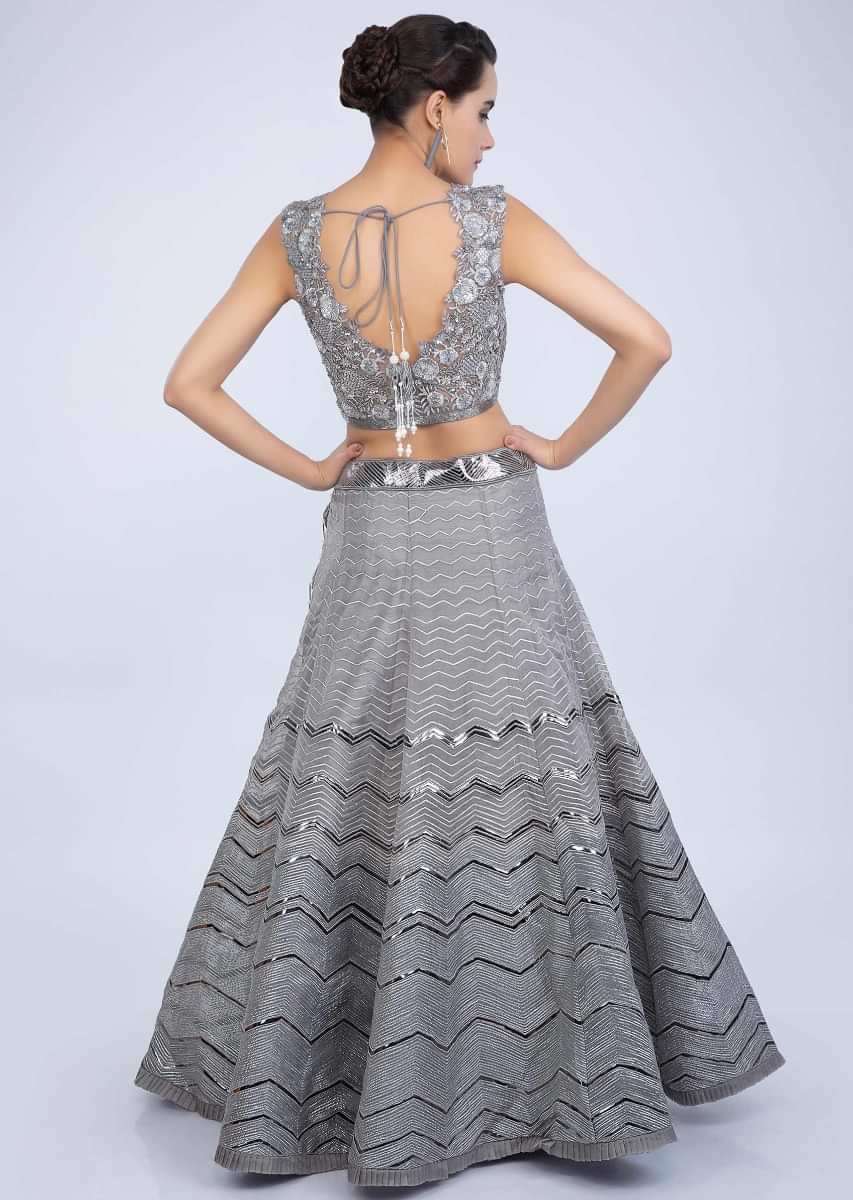 Fog grey organza lehenga paired with matching embroidered net dupatta only on Kalki