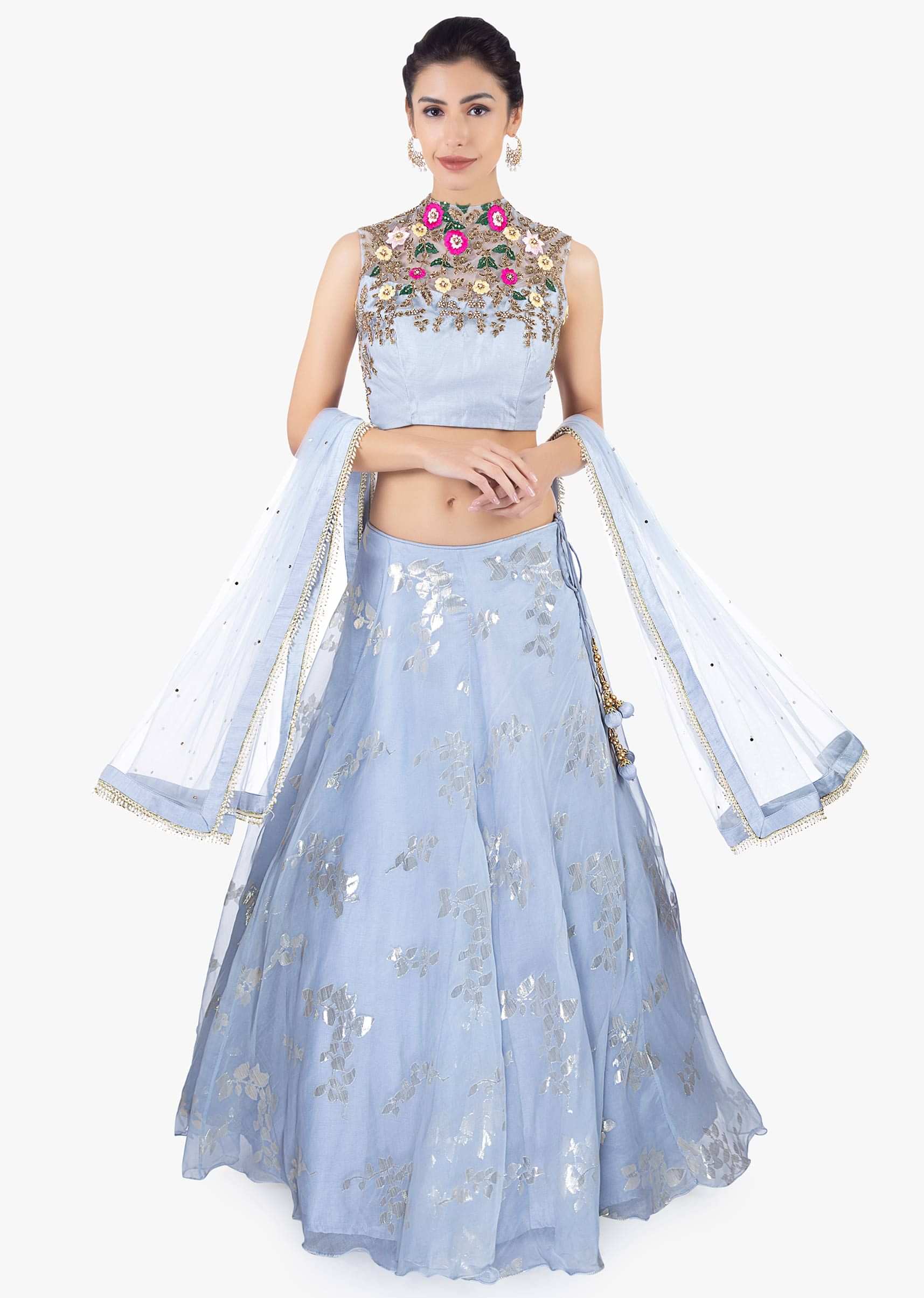 Foil printed organza lehenga paired with an embroidered net blouse and net dupatta 