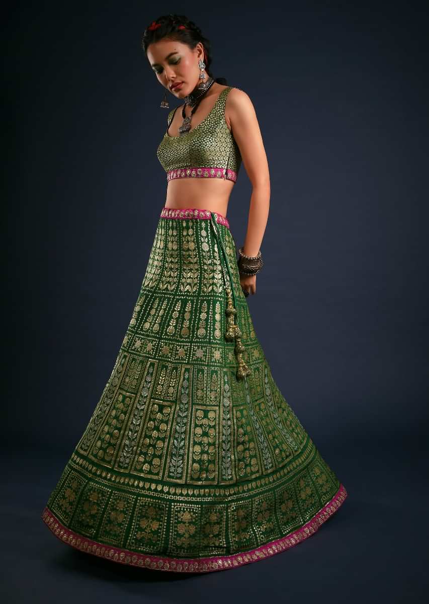 Forest Green Lehenga Set In Brocade Silk With Golden And Silver Woven Kali Design And Contrasting Fuchsia Dupatta 