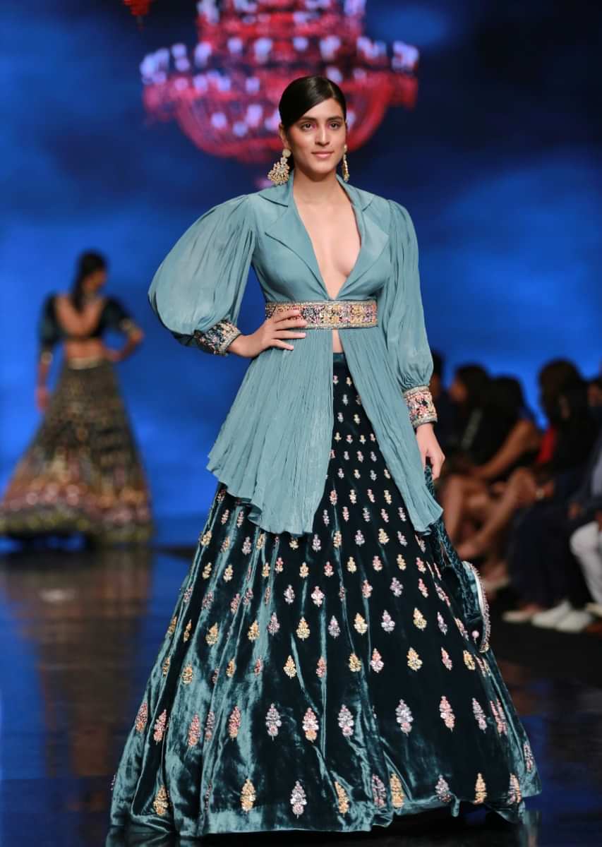 French Blue Lehenga With Hand Embroidered Buttis And Light Blue Peplum Top With Collar Neckline And Bishop Sleeves 