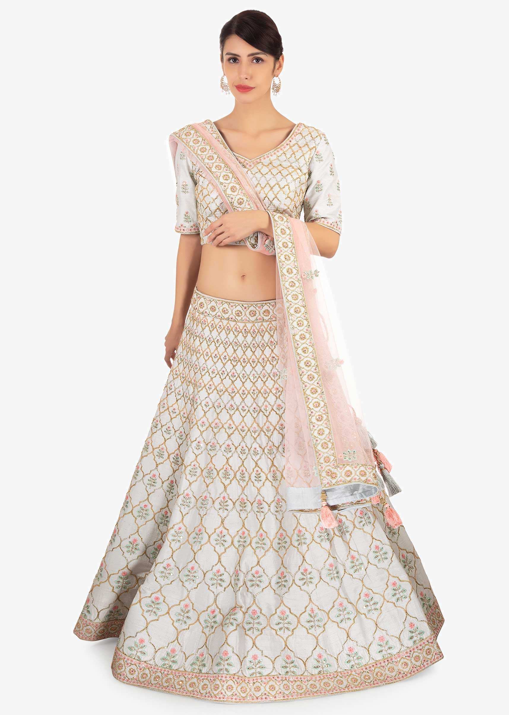 Frost blue  raw silk lehenga set paired with contrasting pink net dupatta