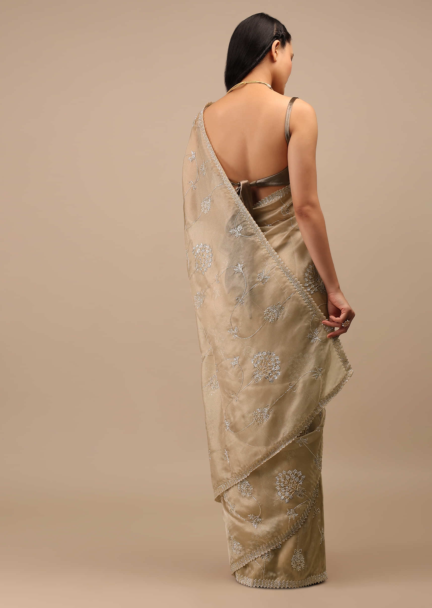 Frosted Almond Tissue Saree In Zardozi Embroidery Buttis, Leafy Motifs Embroidery Detailing On Border 