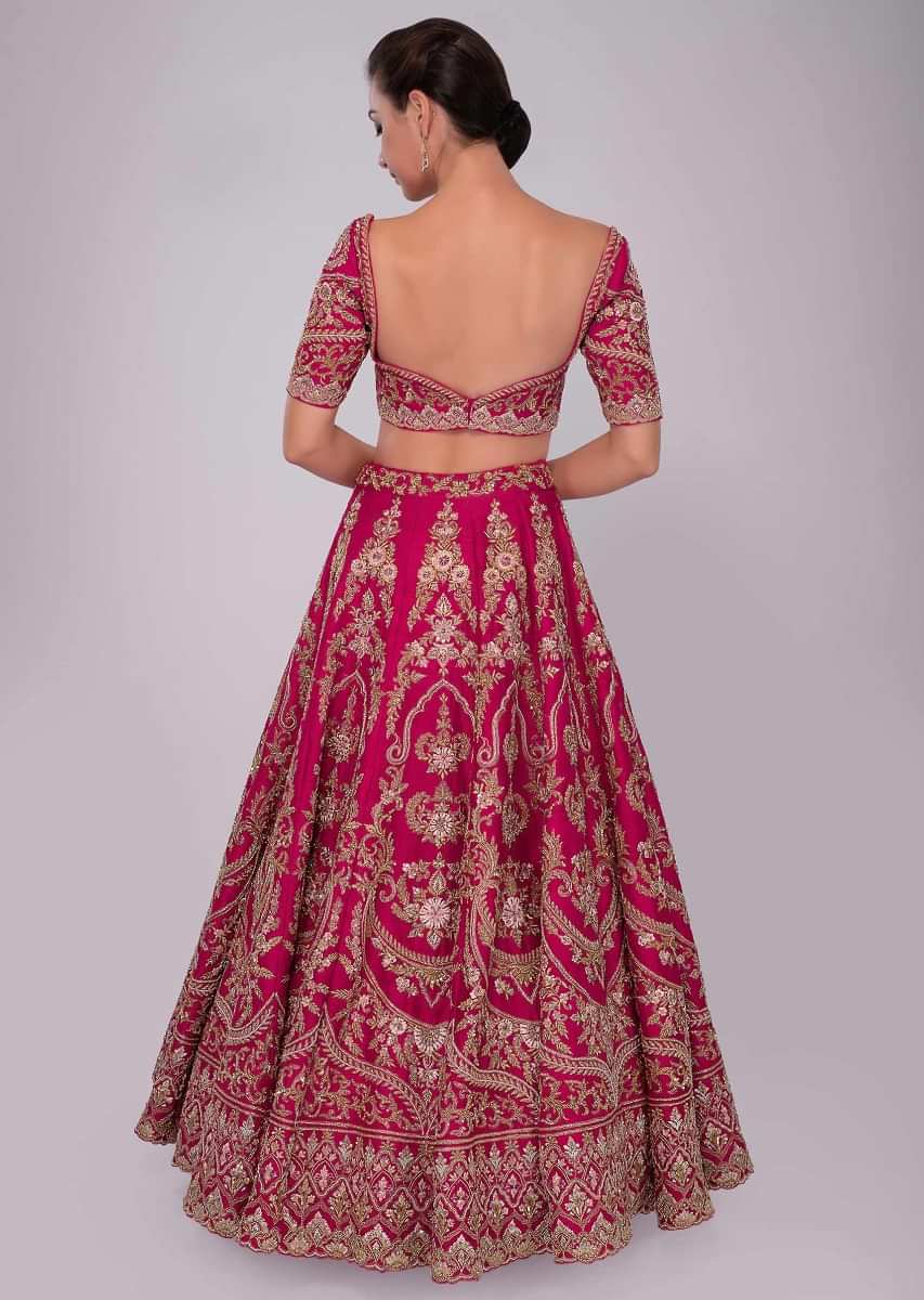 Fuchsia pink raw silk lehenga set in floral and temple embroidery 
