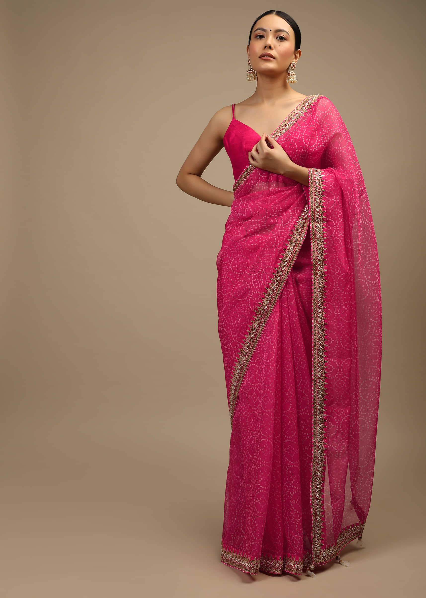 Fuchsia Pink Saree In Organza With Bandhani Jaal And Gotta Patti Embroidered Floral Motifs On The Border  