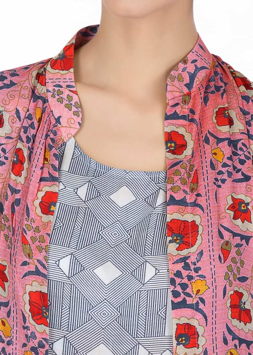 Geometric motif blue cotton tunic dress paired with floral printed cotton jacket