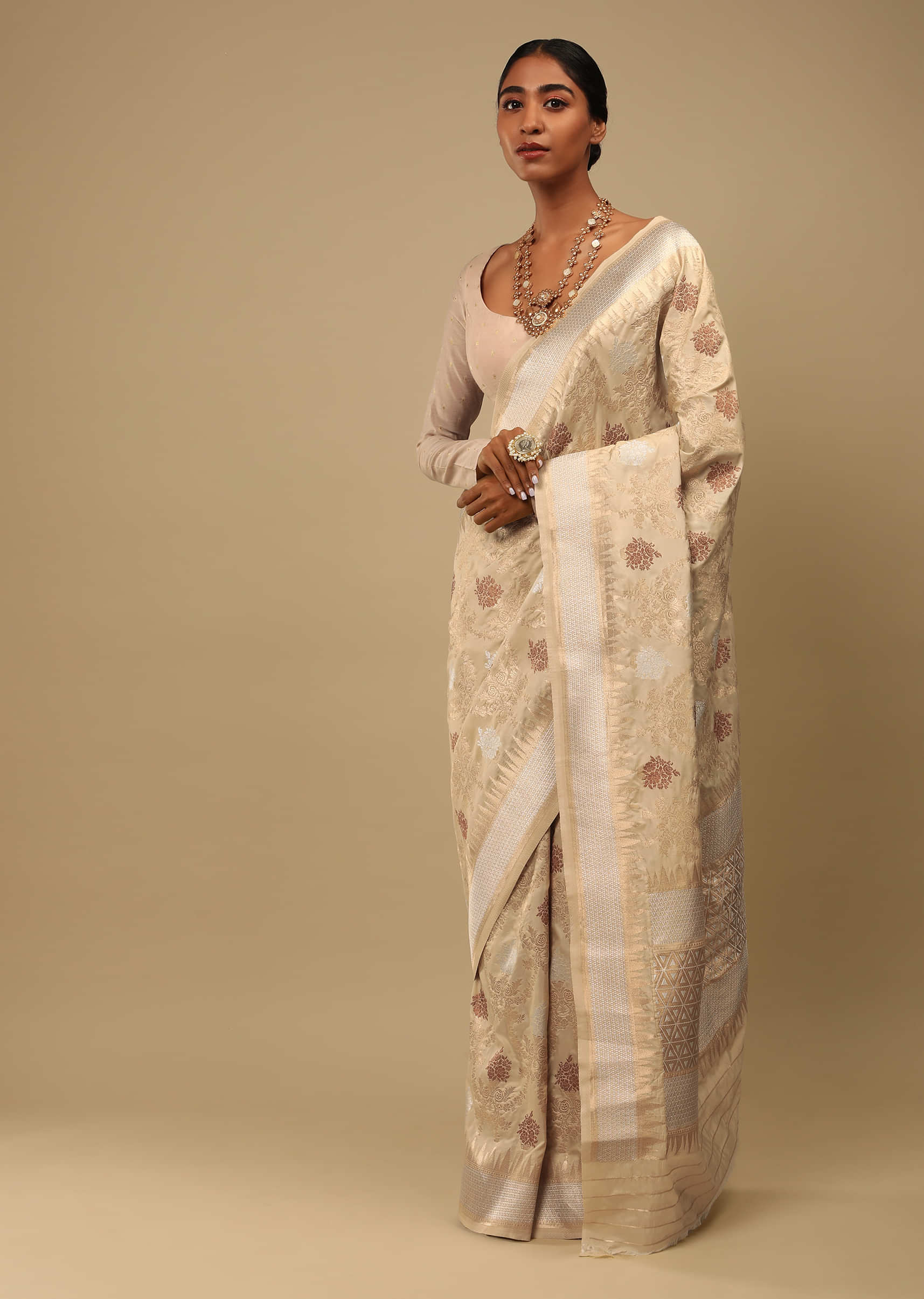 11. The Cream Silk Multi-Colored Jaal Woven Saree With Golden Pallu: 