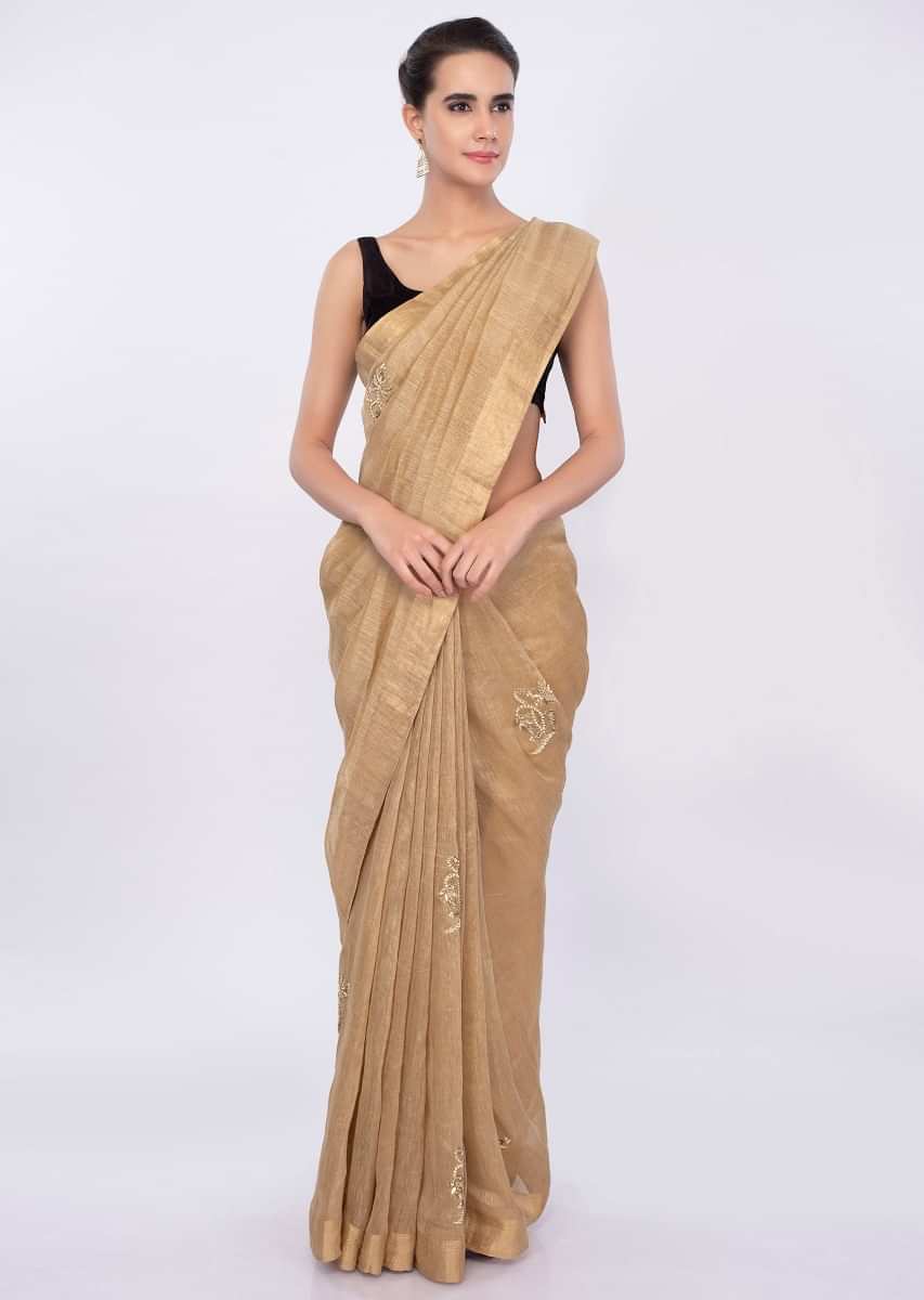 Gold linen saree with embroidered butti only on Kalki