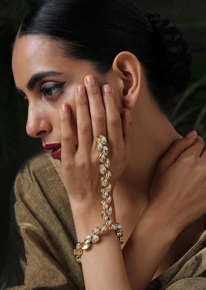 Gold Plated Hathphool Featuring Kundan Arranged In An Exquisite Pattern That Wraps Elegantly On Your Finger By Paisley Pop