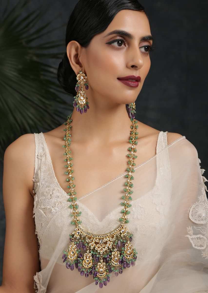 Gold Plated Long Kundan Necklace Set Handcrafted With An Elaborate Pendant Featuring Green And Purple Dangling Stones By Paisley Pop