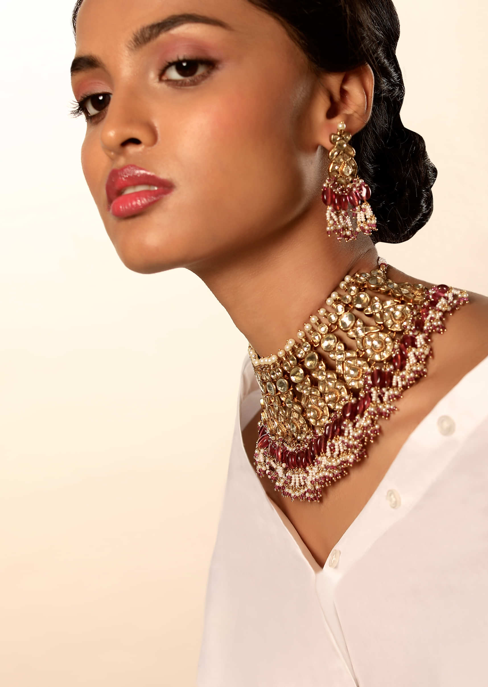 Gold Plated Necklace And Earrings Set With Kundan And Moti Work In Ethnic Motifs Along With Rani Pink And White Bead Fringes 